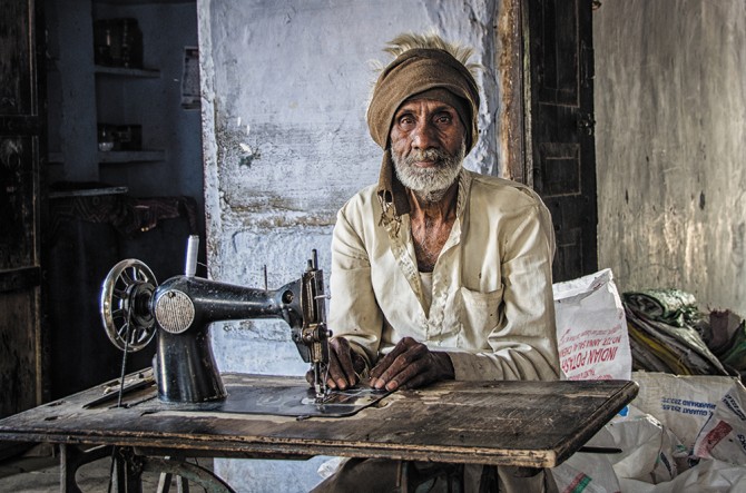 A man sewing in Todi Garh