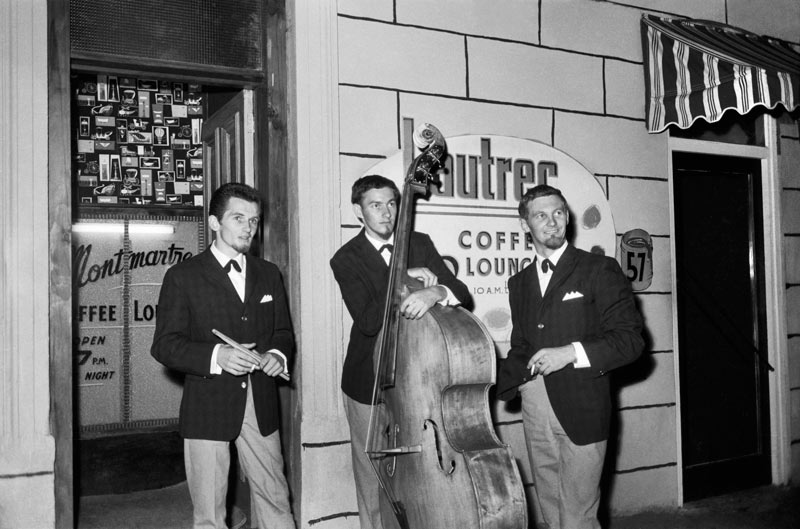 Rykenberg Photography, Seventeen days of Rykenberg, Central City LibraryMike Walker trio outside the Montmartre and Lautrec Coffee Lounge in Lorne Street, 1960s, Sir George Grey Special Collections, Auckland Libraries