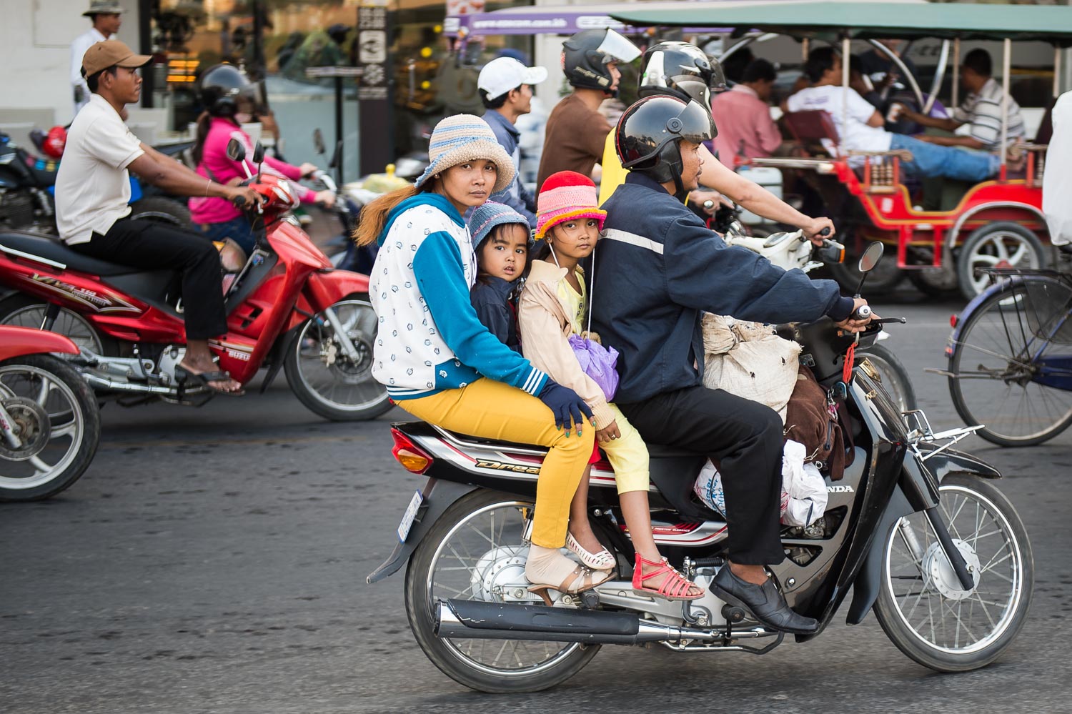 Family on scooter, Phnom Penh;&nbsp;Nikon D4S, 52mm, f/2.8, 1/100s, ISO 110