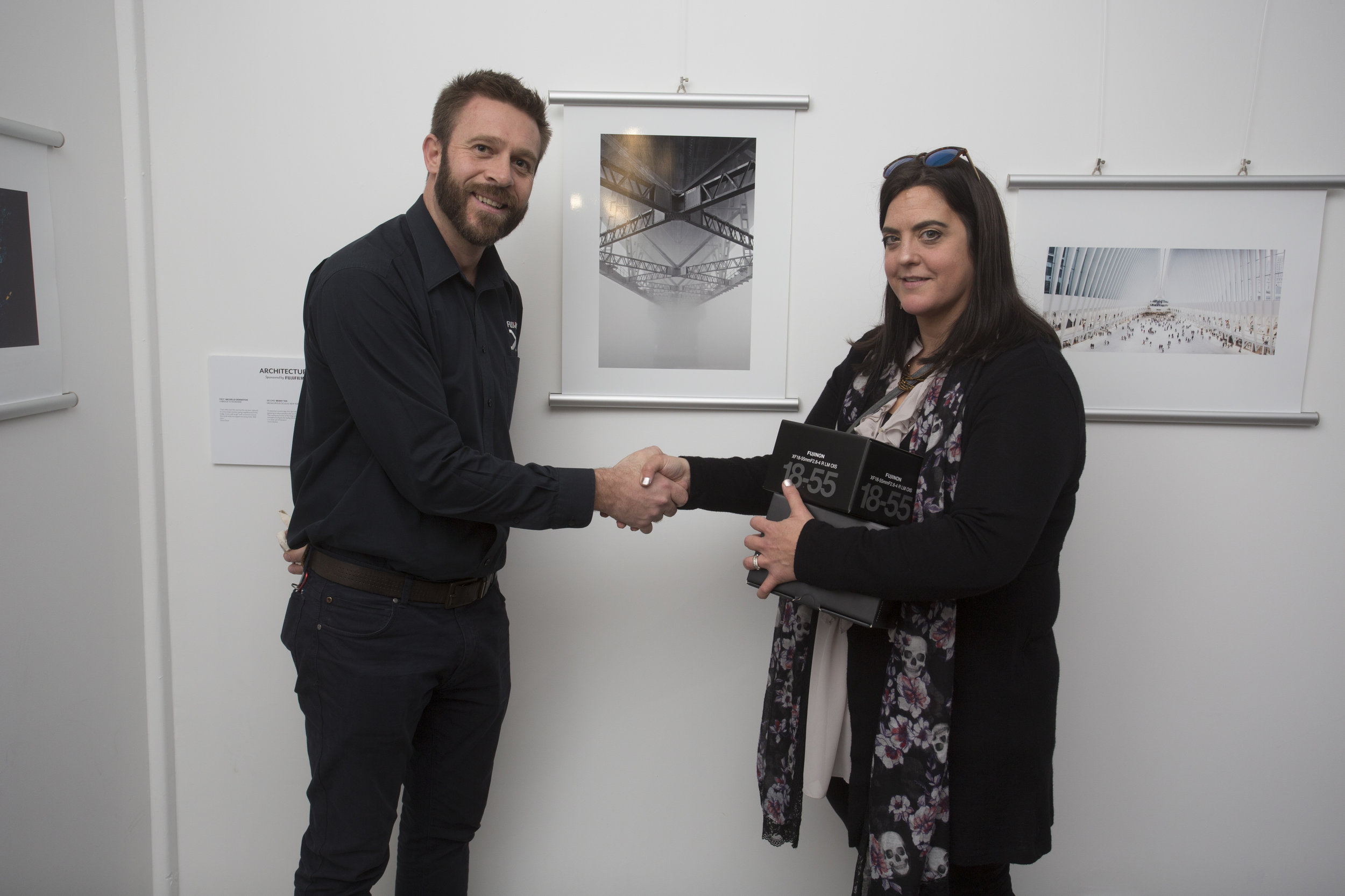  Ira Swales from Fujifilm congratulates Michelle Denniston, who achieved first place in Architecture 