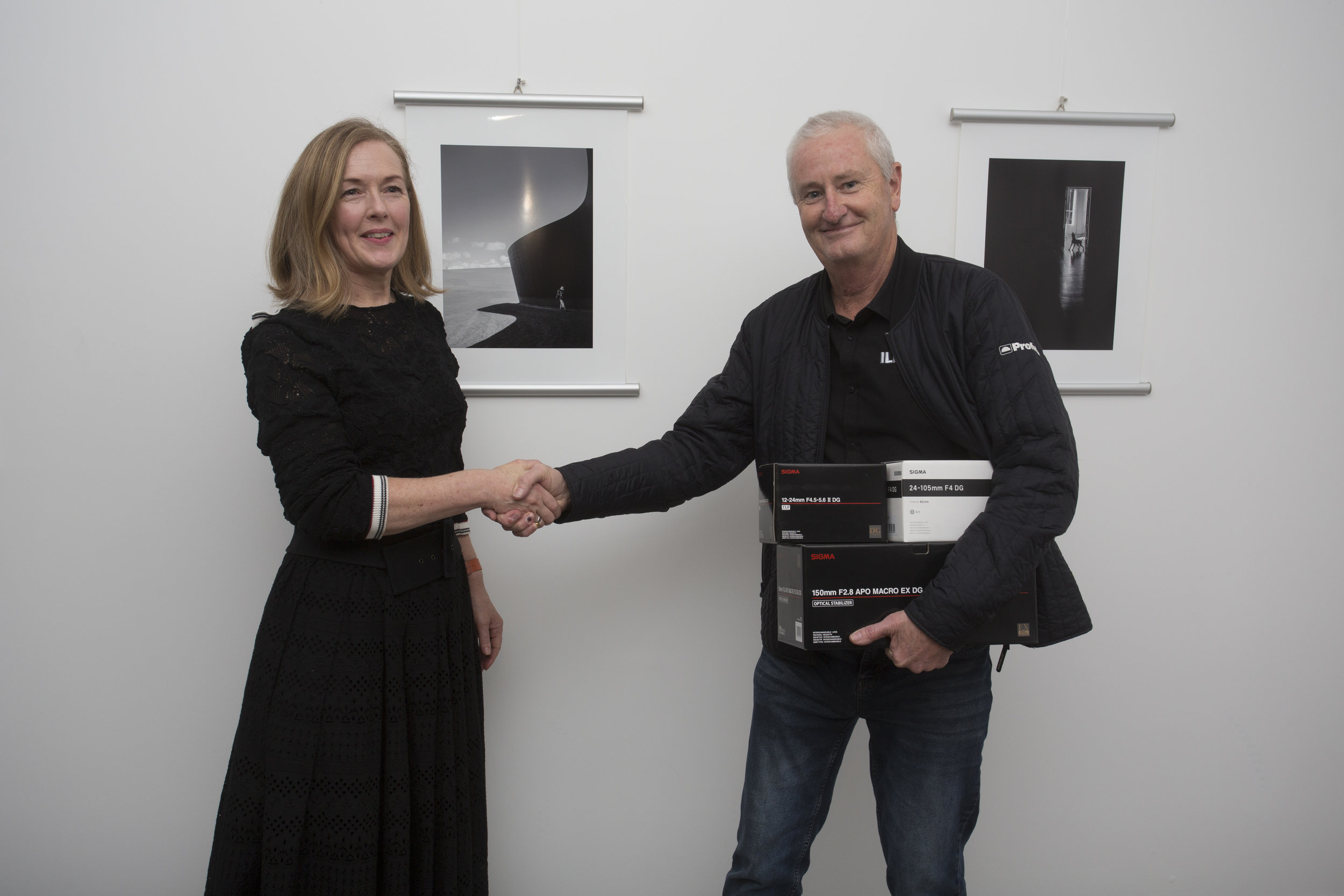  Amateur Photographer of the Year for 2018, Kate Parsonson, with her two winning images, receiving prizes from Mark Ward of Sigma/CRK 